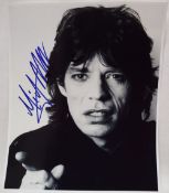 Mick Jagger - A black and white photograph, signed in blue pen, 24.5 x 20.