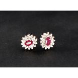 A pair of ruby and diamond earrings,