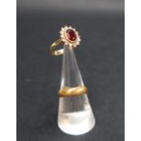 An 18ct yellow gold garnet and diamond cluster ring,