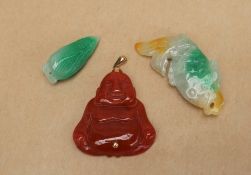 A Jade lotus bud pendant together with a jadeite fish and a jadeite buddha pendant