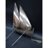 A continental white metal boat with twin sails and oars, marked 800,