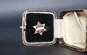 An 18ct gold long service tie stud for the Anglo-American Oil Co set with diamonds to two points of