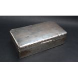 A silver cigarette box, of rectangular form, with line decoration,