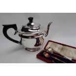 A George VI silver teapot, on a spreading foot, Sheffield, 1937,
