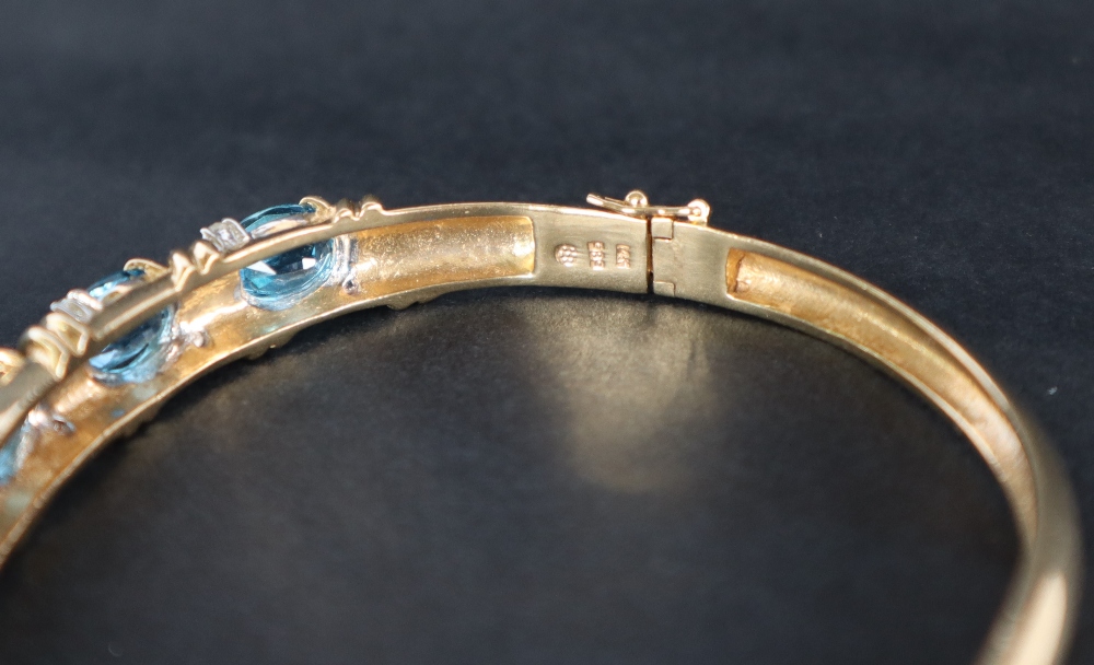 A 14ct yellow gold blue topaz and diamond set hinged bangle, - Image 4 of 5