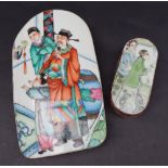 A Chinese porcelain polychrome panel decorated with figures in an interior, mounted in a copper box,