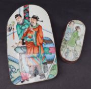 A Chinese porcelain polychrome panel decorated with figures in an interior, mounted in a copper box,