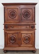 An 18th century French walnut and ebonised buffet a deux corps,