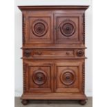 An 18th century French walnut and ebonised buffet a deux corps,