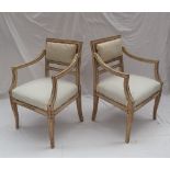 A pair of 19th century French elbow chairs,