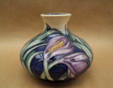 A limited edition Moorcroft pottery vase decorated in the "Saffron Crocus" pattern,