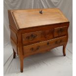 A French provincial Louis XVI walnut bombe bureau,