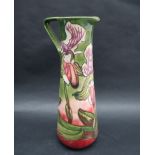 A Moorcroft pottery limited edition slender jug decorated in the Himalayan Orchid pattern,