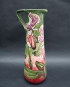 A Moorcroft pottery limited edition slender jug decorated in the Himalayan Orchid pattern,