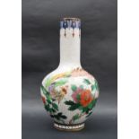 A Cloisonne enamel vase, wit a white ground, decorated with a bird of paradise, and flower heads,