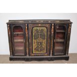 A 19th century ebonised cut brass credenza, with a cushion top,