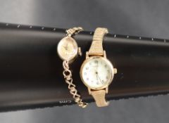 A lady's 9ct gold Accurist wristwatch, the circular dial with batons on a 9ct gold bracelet strap,