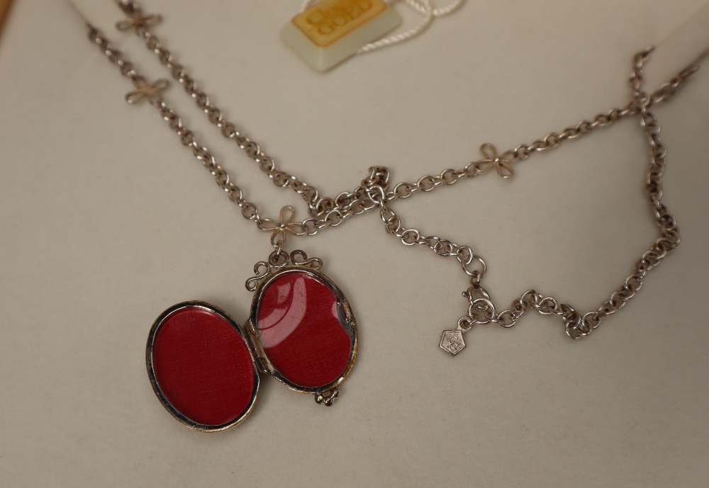 A Clogau silver locket with an applied gold daffodils on a silver necklace, approximately 17. - Image 3 of 4