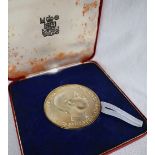 A silver medallion produced by the Royal Mint to commemorate the Investiture of HRH Prince Charles
