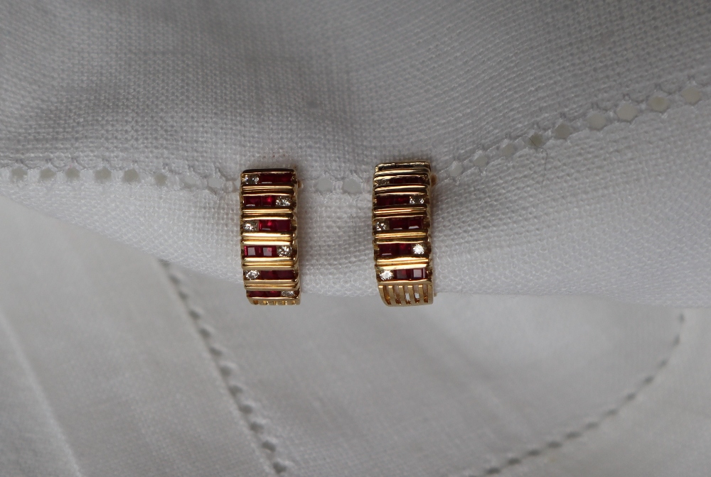 A pair of ruby and diamond hoop earrings,