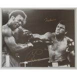 Boxing - A black and white framed action shot of Muhammad Ali and George Foreman,