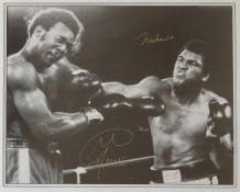 Boxing - A black and white framed action shot of Muhammad Ali and George Foreman,