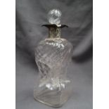 An Edward VII silver topped decanter,