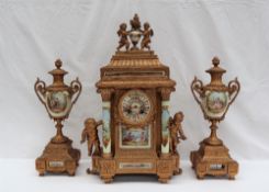 A 19th century French spelter clock garniture, with cherub and vase surmount,