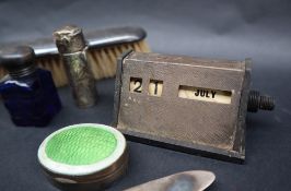 A George VI silver desk calendar, London, 1939, together with a silver and enamel pill box,