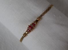 A 14ct yellow gold ruby and diamond bracelet,