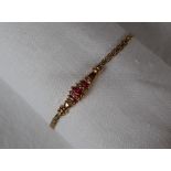 A 14ct yellow gold ruby and diamond bracelet,