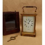 A French brass carriage clock, with a white enamel rectangular dial and Roman numerals inscribed J.