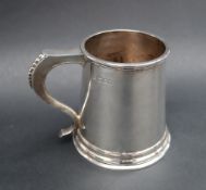 An Elizabeth II silver tankard, of tapering cylindrical form with a spreading foot, London, 1967,