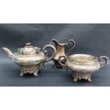A Victorian silver three piece teaset, of inverted baluster form decorated with leaves and flowers,