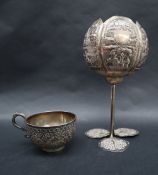 An Indian white metal mug,