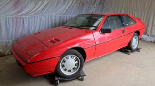 A Lotus Excel, registration number KIW 2704, 2174cc, first registered August 1985, in red,