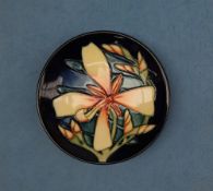 A Moorcroft pottery pin tray, decorated in the Panache pattern, dated 2004,