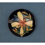 A Moorcroft pottery pin tray, decorated in the Panache pattern, dated 2004,