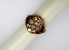 An 18ct yellow gold opal, diamond and ruby ring, set with four round cabochon opals,