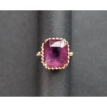 An 18ct yellow gold amethyst set dress ring,