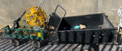 An Agricultural trailer together with another trailer and a hose pipe