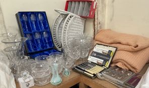 Crystal drinking glasses together with glass vases, bowls, cased flatwares,