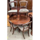 A Victorian mahogany supper table together with a set of six Victorian balloon back dining chairs