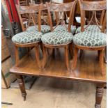 An early 20th century extending dining table on reeded legs together with a set of six continental
