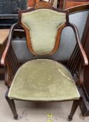 An Edwardian inlaid elbow chair,