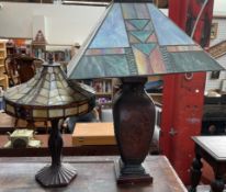 An Oriental inspired lamp base with a Tiffany style lamp shade together with another table lamp