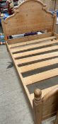 A pine double bed,