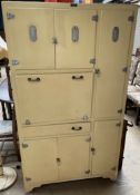 A mid 20th century "Gilda" kitchen cabinet in yellow with chrome fittings