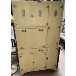 A mid 20th century "Gilda" kitchen cabinet in yellow with chrome fittings