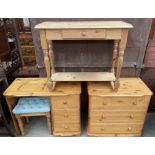 A 20th century pine chest of drawers with matching dressing table and stool,